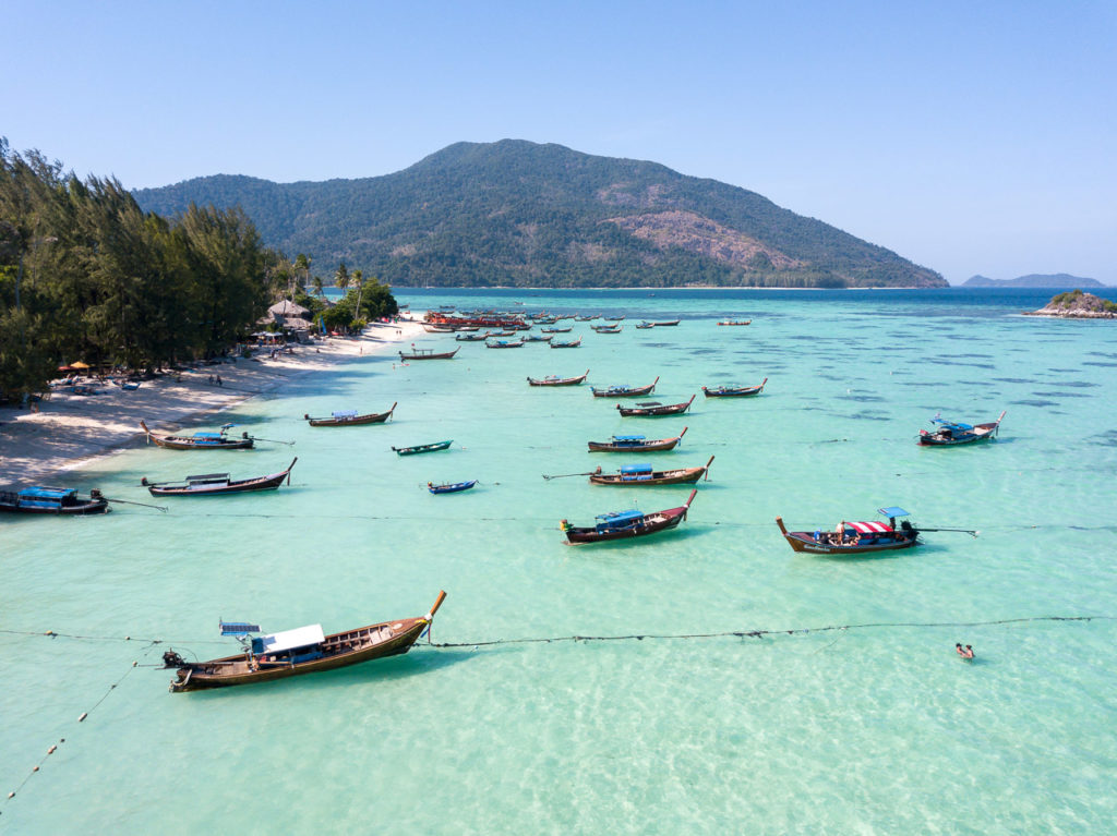 Long-tail boats at Sunrise Beach, Koh Lipe & Koh Adang in the background