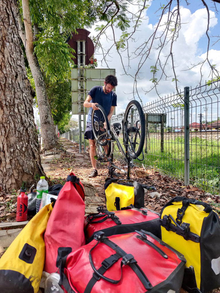 Armand fixing a puncture on Trirat Road, Chumphon