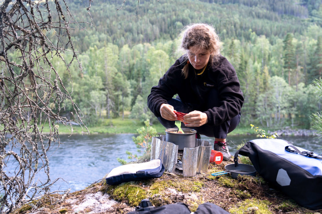 Johanna cooking at our wild camping spot nearby Stavn, Flå